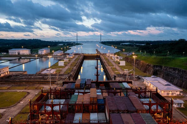 The Panama Canal is seen from the perspective of a container ship that is about to enter it.